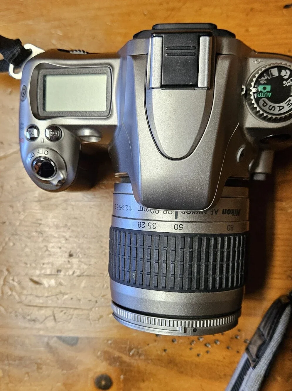 Nikon N55 35mm SLR Film Camera with Black Zoom Lens and Strap